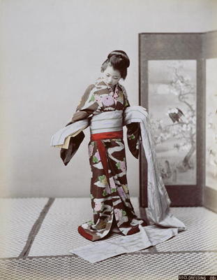 Young Japanese Girl Dressing, late 19th century (hand coloured photo) from Japanese School, (19th century)