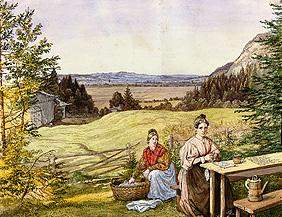 Blick über eine Hügellandschaft mit zwei Frauen an einem Tisch.